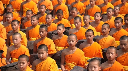 Monks praying in a Thailand temple