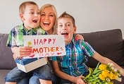 two sons celebrating Mother's Day with their mother